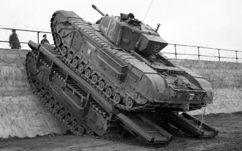 A Churchill Tank Mounting A Sea Wall Using An Ark As A Ramp