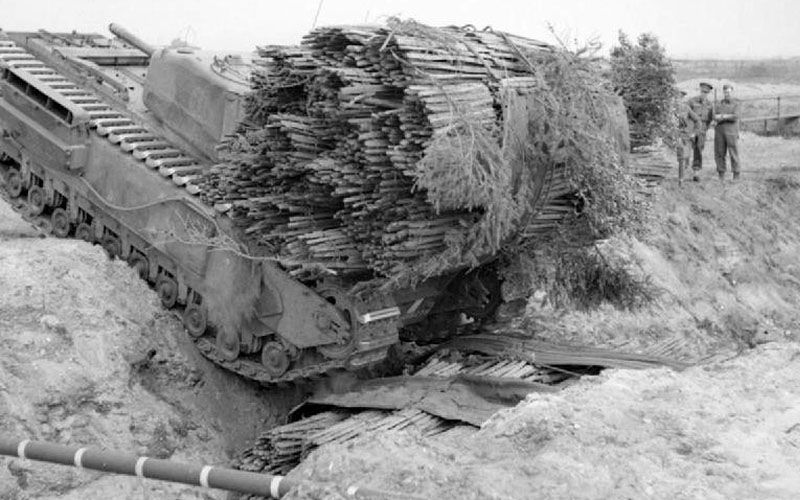 A 'Fascine' Laying Churchill AVRE About to Cross a Ditch Already FIlled with a Fascine from Another Tank