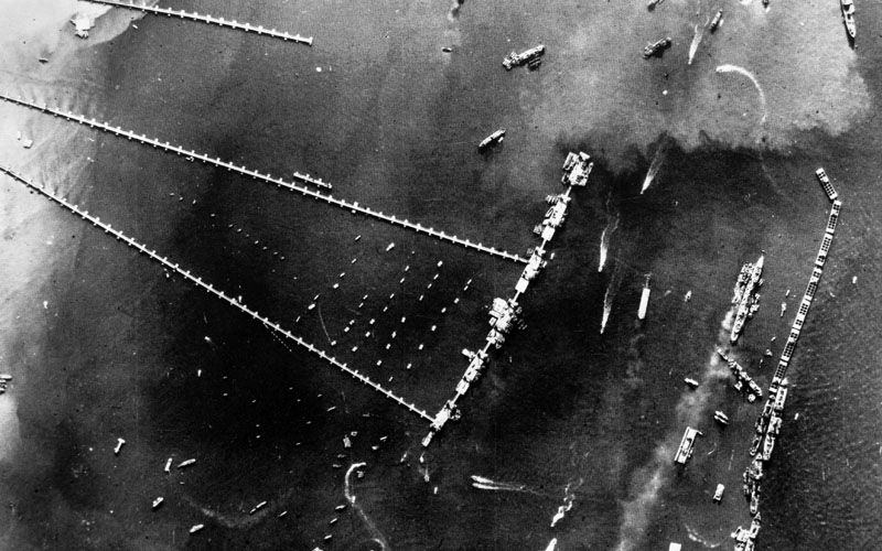 Aerial Photograph With Whale Floating Roadways Visible On The Left And Caissons And Block Ships Visible On The Right