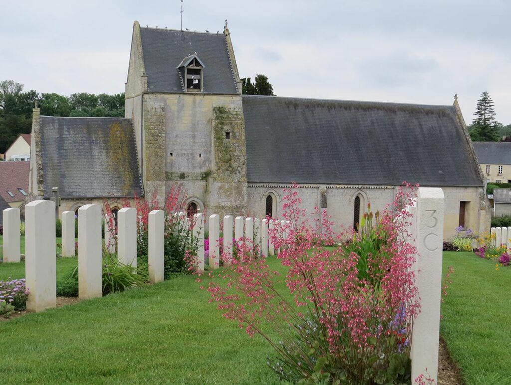 Headstones And Church At Brouay War Cemetery