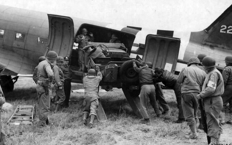 Jeep Being Loaded Into The Cargo Area Of A C 47