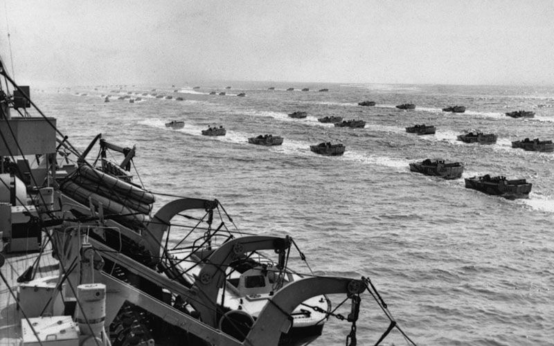 Lines Of Landing Craft On Their Way To The Beach