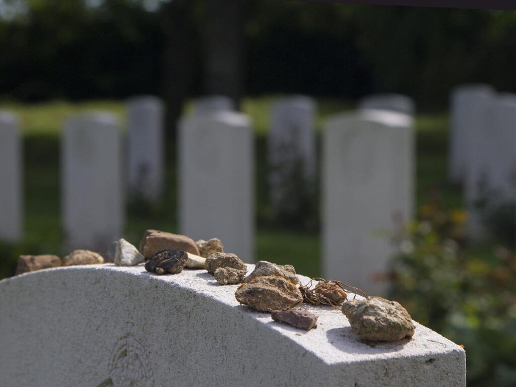 Remembrance Rocks On Headstone At Hermanville War Cemetery