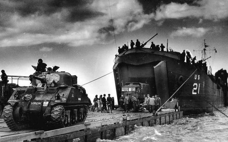 Vehicles being unloaded from an LST (Landing Ship Tank) in Normandy